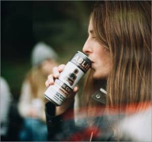 A girl in leather jacket drinking Ablis